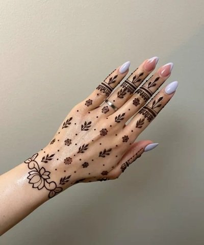 10 Best Back Hand Mehndi Designs in 2025 1 back hand mehndi design,simple mehndi design,mehndi design simple,arabic mehndi design,easy mehndi design back hand mehndi design 10 Best Back Hand Mehndi Designs in 2025 Minimalist Back Hand Mehndi Design