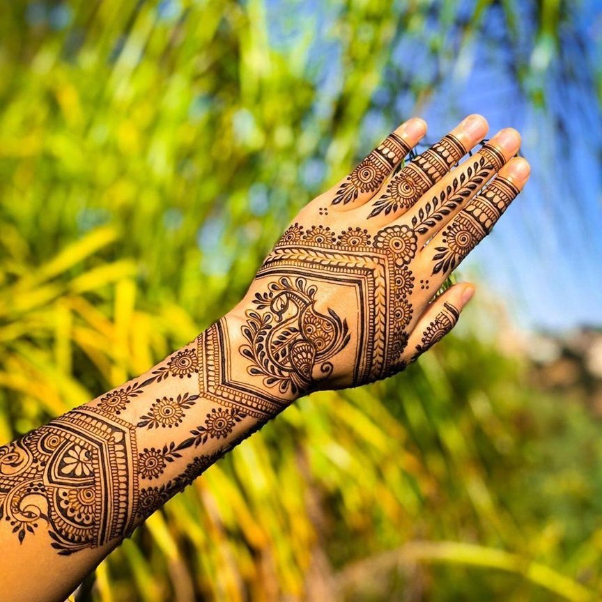 10 Best Back Hand Mehndi Designs in 2025 3 back hand mehndi design,simple mehndi design,mehndi design simple,arabic mehndi design,easy mehndi design back hand mehndi design 10 Best Back Hand Mehndi Designs in 2025 Peacock Back Hand Mehndi Design